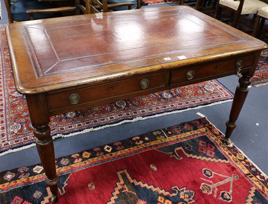 A Victorian mahogany leather topped writing table, W.130cm